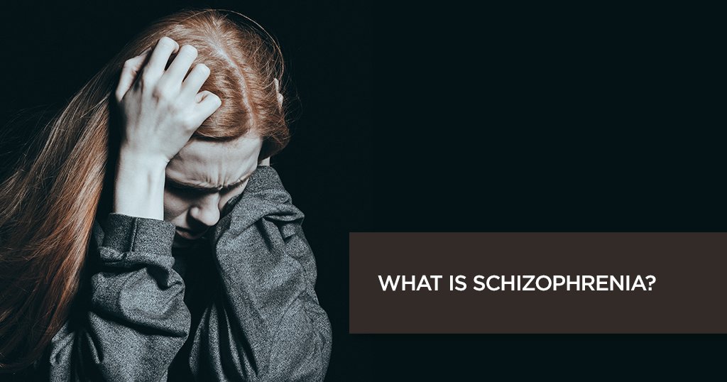 A person with distressing symptoms of schizophrenia, holding their head, symbolizing the emotional and cognitive challenges associated with the disorder.